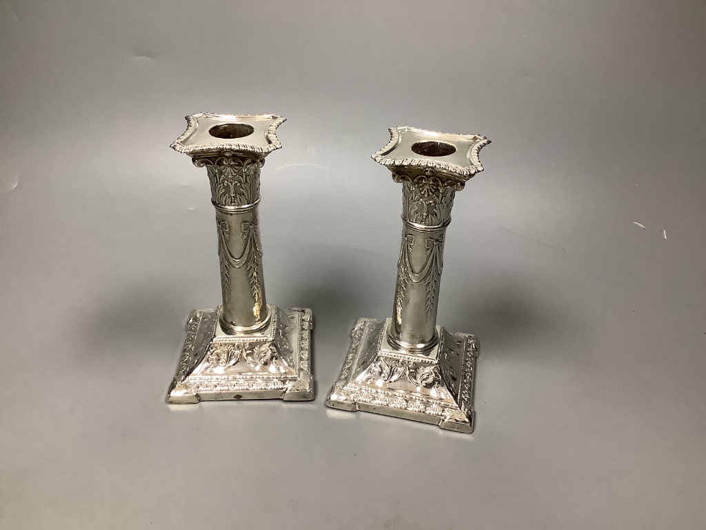 A pair of Edwardian silver candlesticks